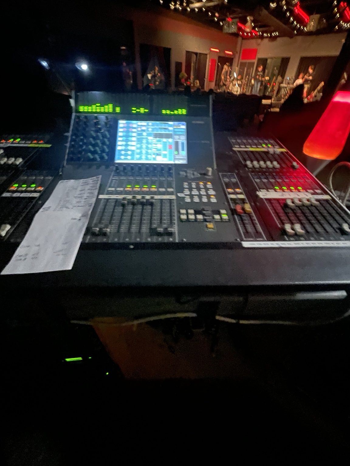 Digital mixing console with stage in background